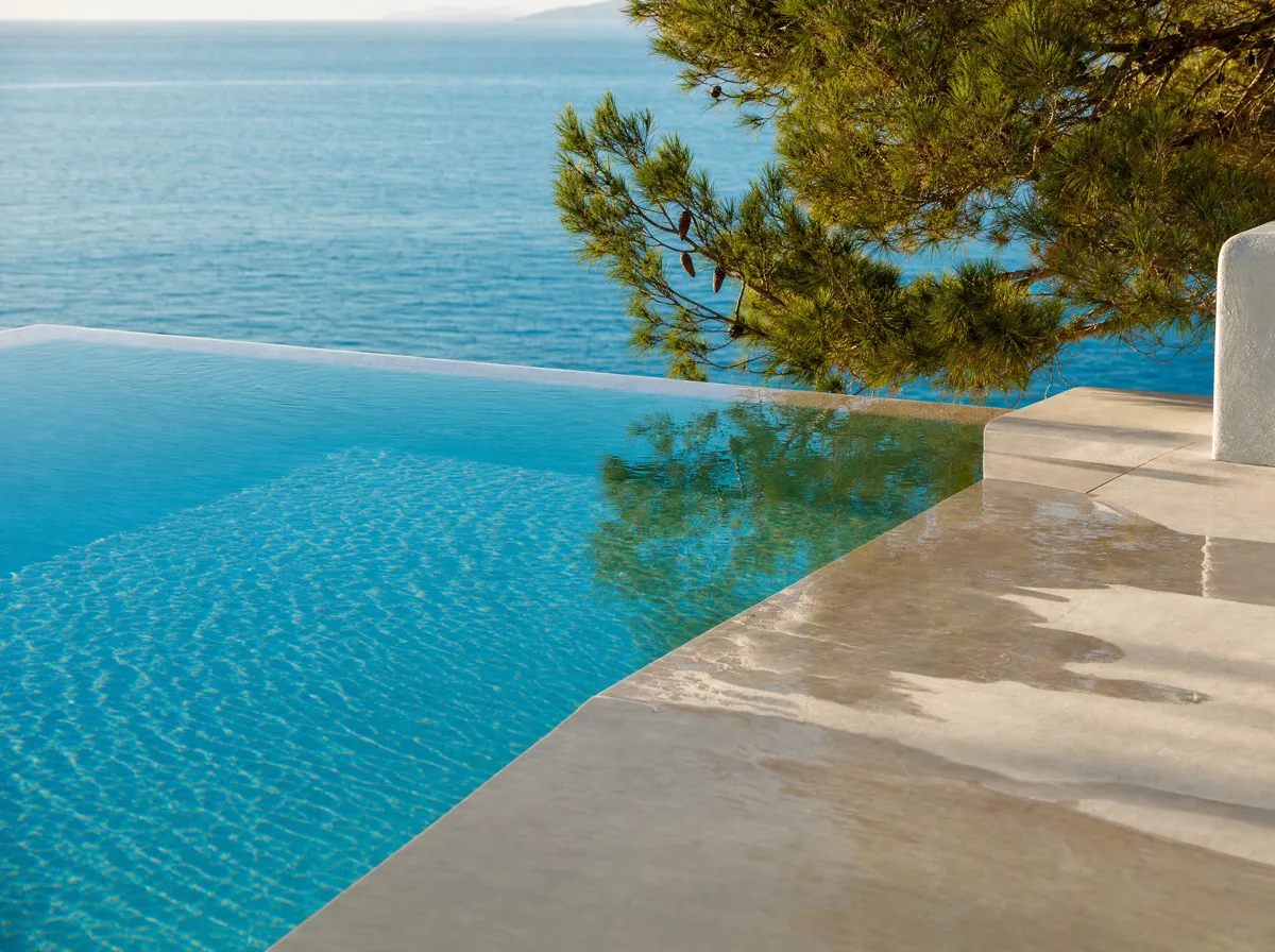 Infinity pool edge merging with the sea